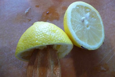 Lemon halves on a cutting board.