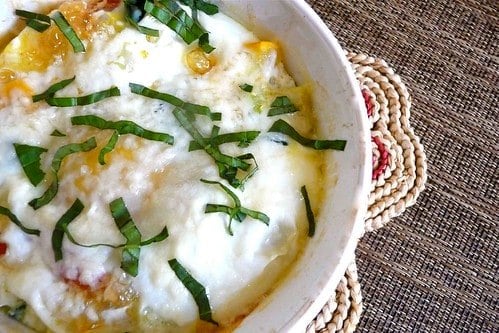 Baked Eggs and vegetables in a large white ramekin.