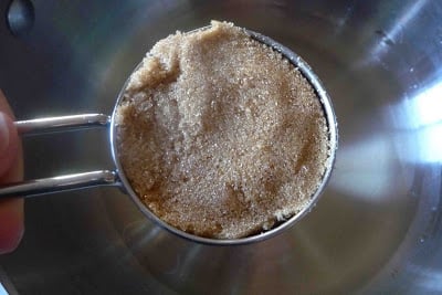A measuring cup of brown sugar.