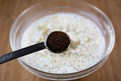 Teaspoon measure of ancho chile powder.