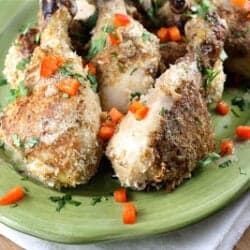 Crispy Baked Chicken Drumsticks with Dijon and chile on a green plate.