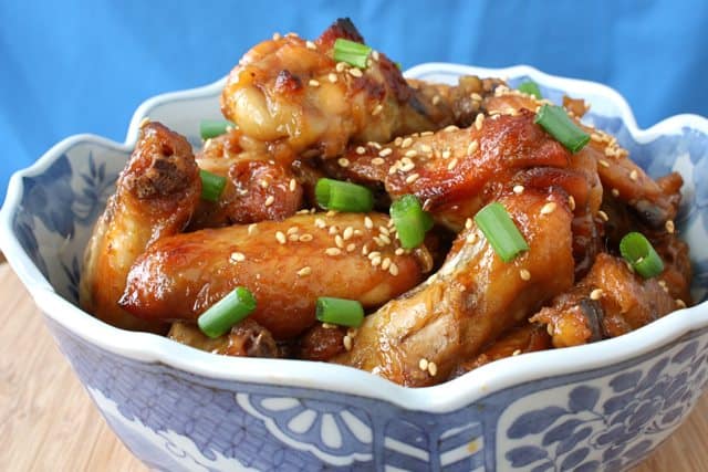 Soy honey chicken wings in a blue decorated bowl