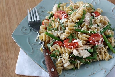 Chicken pasta salad on a blue plate.