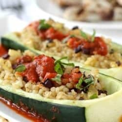 Zucchini boats stuffed with rice and tomatoes.
