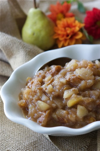 This easy crockpot pear applesauce with ginger takes very little effort when made in the slow cooker. Eat it on its own or scoop it onto ice cream. #crockpot #slowcooker #applesauce