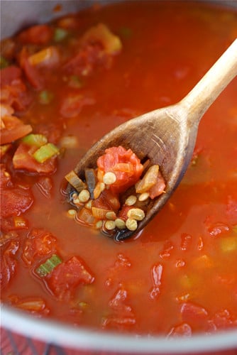 Broth, lentils and diced tomatoes in a large saucepan.
