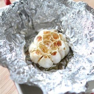 If you have ever wondered how to roast garlic at home, this tutorial lays out all of the steps for you, including photos. #garlic #howto