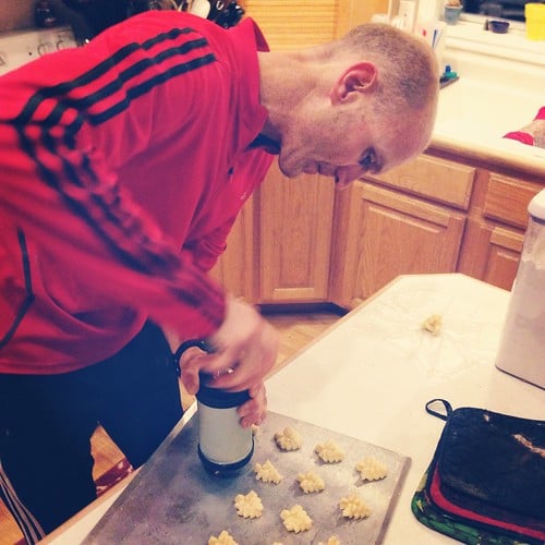 A man making spritz cookies.