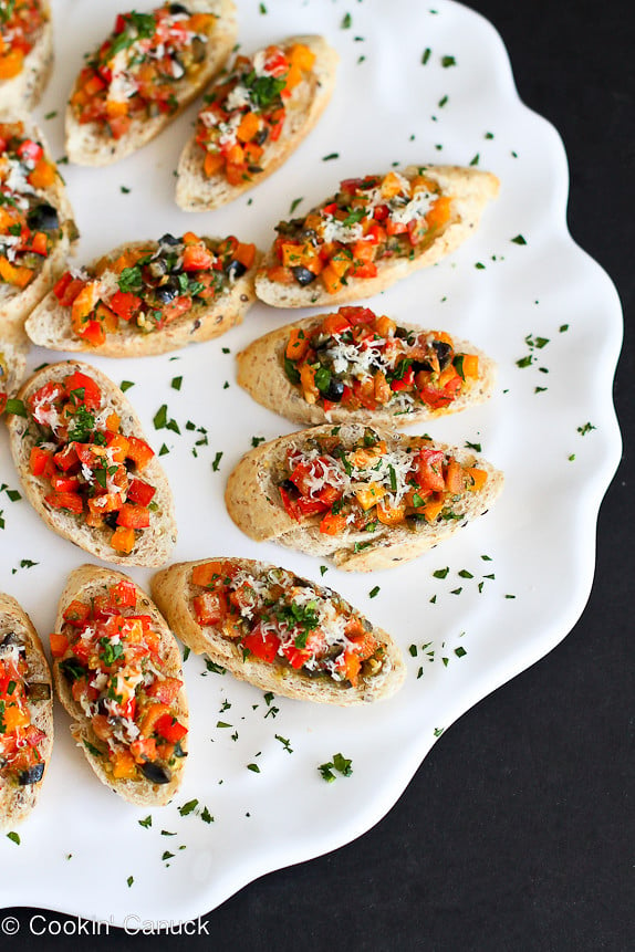 Skinny Pesto Pizza Crostini...Great for a crowd! So easy that the kids can make these. 51 calories & 1 Weight Watcher PP | cookincanuck.com #recipe #appetizer #vegetarian
