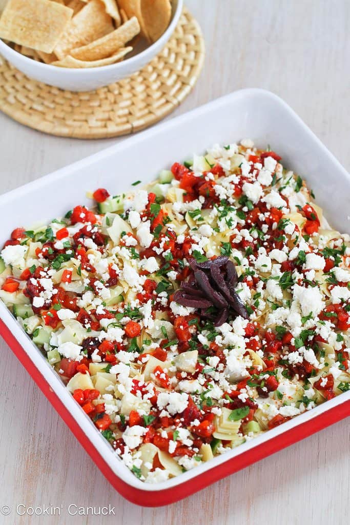 Put a fresh spin a classic appetizer recipe with this Healthy Mediterranean 7-Layer Dip. Perfect for afternoon snacking or game day! 49 calories and 1 Weight Watchers Freestyle SP