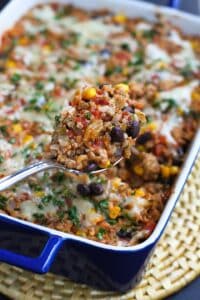 This southwestern turkey rice casserole is a fantastic mix of spices, vegetables and lean protein. It all comes together in about 30 minutes for a healthy dinner. 267 calories and 5 Weight Watchers Freestyle SP #casserole #healthy #dinner