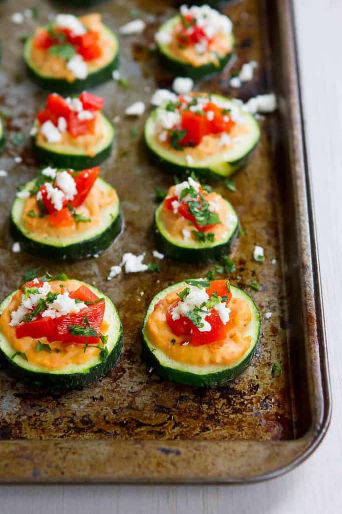 These Baked Zucchini Hummus Bites are fantastic for healthy snacking or appetizers! Vegetarian and gluten free. For 2 bites…39 calories and 1 Weight Watchers Freestyle SP