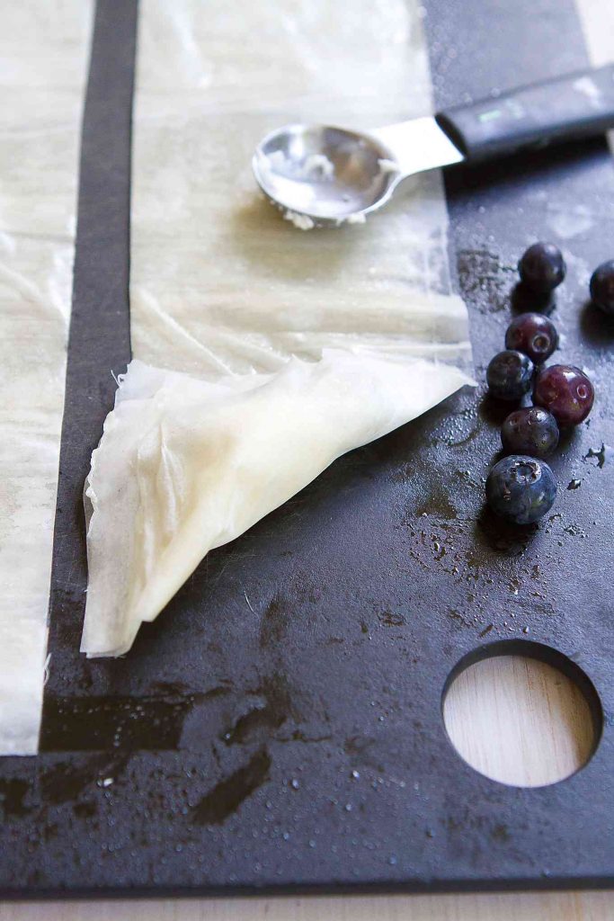 These 4-Ingredient Blueberry Goat Cheese Phyllo Turnovers make the most irresistibly flaky and delicious desserts or appetizers. 54 calories and 2 Weight Watchers Freestyle SP