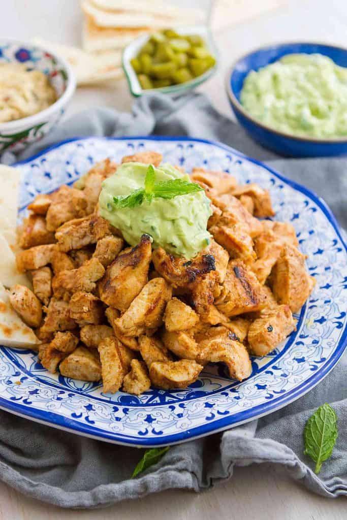This Grilled Chicken Shawarma with Avocado Tzatziki is fantastic on its own or when served up with pita bread and hummus! 300 calories and 3 Weight Watchers Freestyle SP