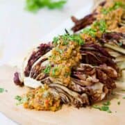 This smoky grilled radicchio is dressed up with an easy olive orange tapenade that is bursting with flavor! 85 calories and 2 Weight Watchers Freestyle SP