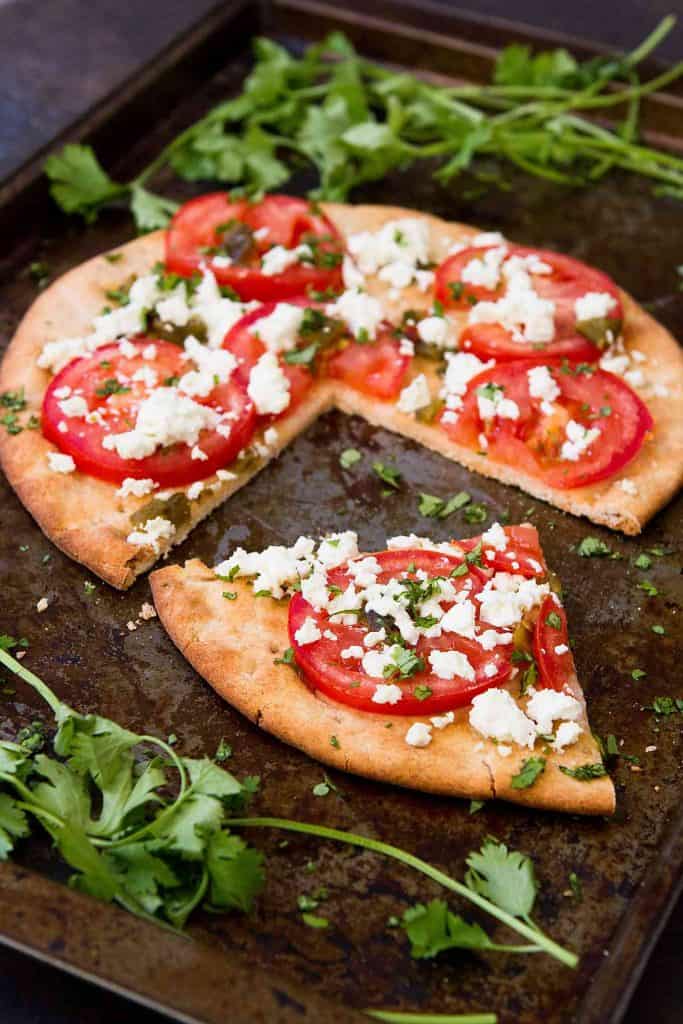 This vegetarian Feta Jalapeno Tomato Flatbread is fantastic for a spur of the moment meal or as an easy appetizer to share with friends. 172 calories and 6 Weight Watchers Freestyle SP