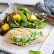 Impress your guests with these surprisingly easy Grilled Spinach Artichoke Stuffed Chicken Breasts! 284 calories and 4 Weight Watchers Freestyle SP