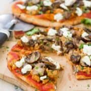 This whole wheat Sausage Mushroom Naan Pizza is piled high with chicken sausage, garlic mushrooms and tangy goat cheese. Only 30 minutes to make! 317 calories and 9 Weight Watchers Freestyle SP