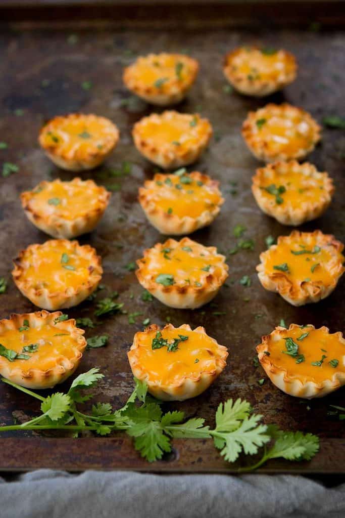 Each bite of these light but gloriously cheesy and crispy pumpkin queso phyllo bites make tailgating and fall party snacking even better. 75 calories and 2 Weight Watchers Freestyle SP