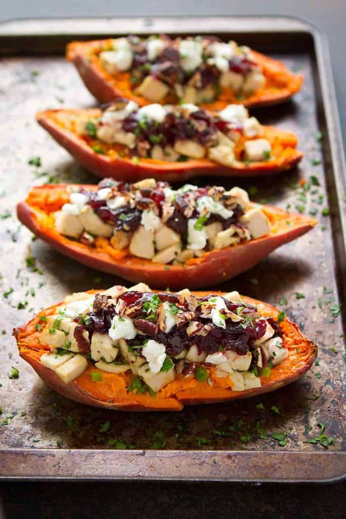 Leftovers have never tasted so good! These Turkey (or chicken), cranberry and goat cheese stuffed sweet potatoes are healthy and delicious. 274 calories and 7 Weight Watchers Freestyle SP