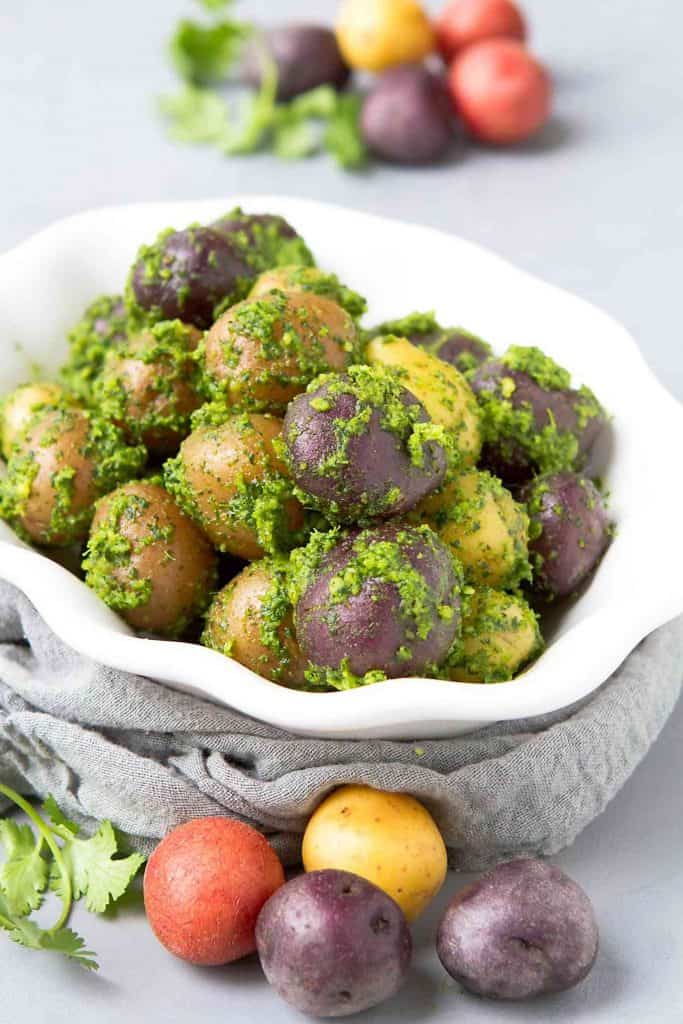 Elevate a simple dish by tossing them with a delicious pesto! These Boiled Cilantro Lime Potatoes are fantastic for any occasion. 153 calories and 4 Weight Watchers Freestyle SP #vegan #recipe