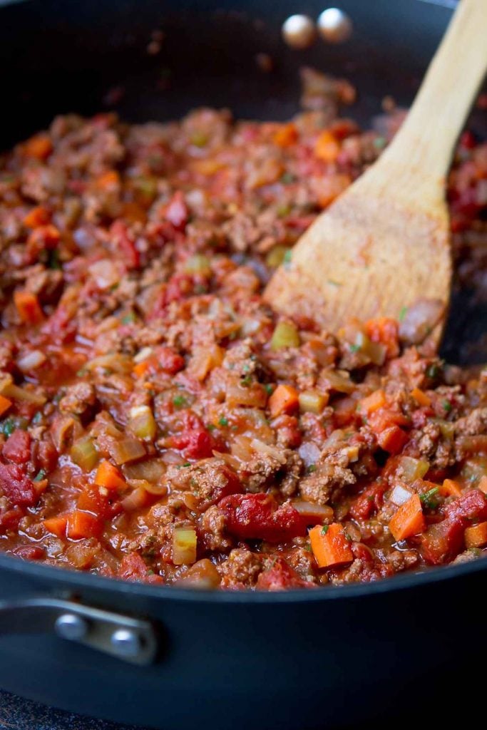 Beef ragu with carrots, cooking in a skillet