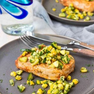 These easy broiled pork chops are rubbed with a spice mixture, cooked in less than 10 minutes, then topped with a sauteed zucchini and corn salsa. 323 calories and 4 Weight Watchers Freestyle SP