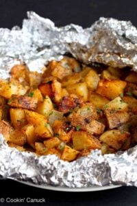 Grilled Potatoes with Rosemary and Smoked Paprika are the ultimate summertime side dish! Wrap everything in a foil packet and through it on the grill. 99 calories and 3 Weight Watchers Freestyle SP #vegan