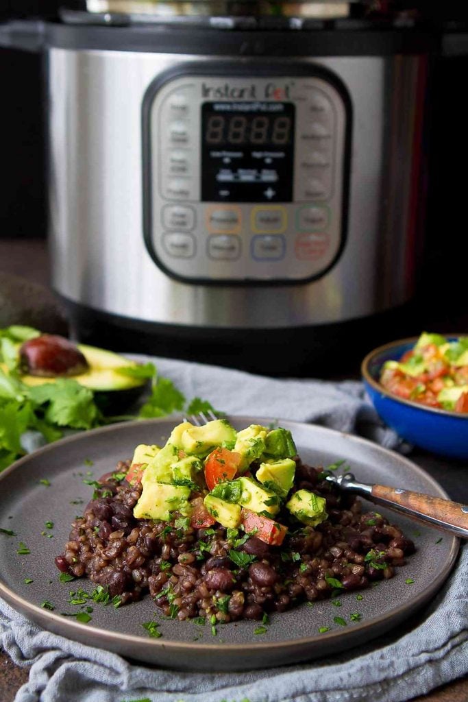 You can't beat Instant Pot Black Beans and Rice with Fresh Avocado Salsa for a healthy, economical, vegan meal that comes together easily! 192 calories and 6 Weight Watchers Freestyle SP