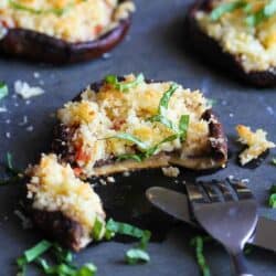 Roasted portobello mushrooms are stuffed with fresh tomatoes and topped with crunchy and cheesy breadcrumbs. It makes a fantastic appetizer or vegetarian entree! 109 calories and 3 Weight Watchers Freestyle SP