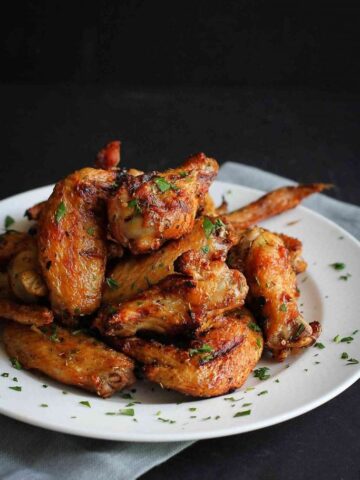 A simple rosemary and garlic marinade makes these grilled chicken wings shine! Add some smoky flavor from the grill for the perfect summertime wings.