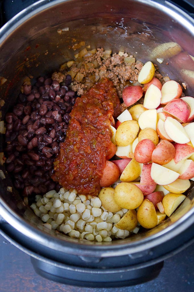 Potatoes, ground beef, beans, salsa and sauteed onions in an Instant Pot.