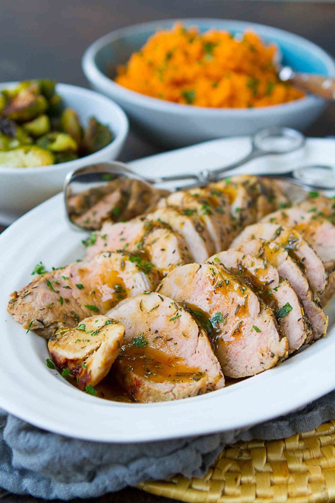Topped with a sweet and savory maple Dijon sauce, this roast pork tenderloin recipe pairs well with mashed sweet potatoes and roasted fall veggies. 250 calories and 4 Weight Watchers Freestyle SP #porktenderloin #recipe #cleaneating #weightwatchers #myfitnesspal