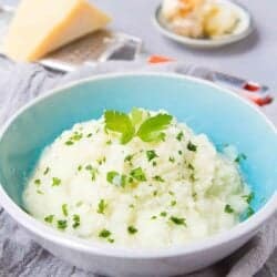 Mashed cauliflower is the way to go if you are cutting your carbs. Parmesan cheese and roasted garlic add boatloads of flavor to this healthy side dish. 84 calories and 2 Weight Watchers Freestyle SP #lowcarb #cauliflower #keto