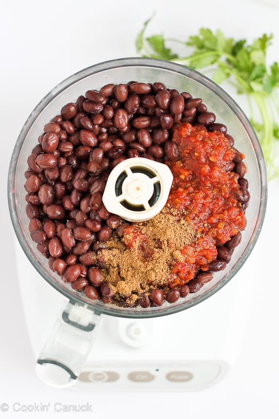 Black beans, salsa and spices in a food processor.