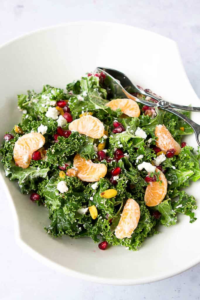 Winter fruit shines in this pretty Kale, Pomegranate and Mandarin Orange Salad. Serve it as a side dish or top it with chicken or shrimp for dinner. 98 calories and 2 Weight Watchers Freestyle SP #kale #cleaneating #weightwatchers