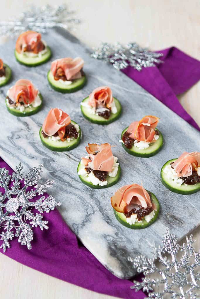 Within 15 minutes, you can have a plateful of savory-sweet prosciutto and goat cheese cucumber appetizers that are guaranteed to disappear in a flash! 24 calories and 1 Weight Watchers Freestyle SP #appetizer #newyearseve