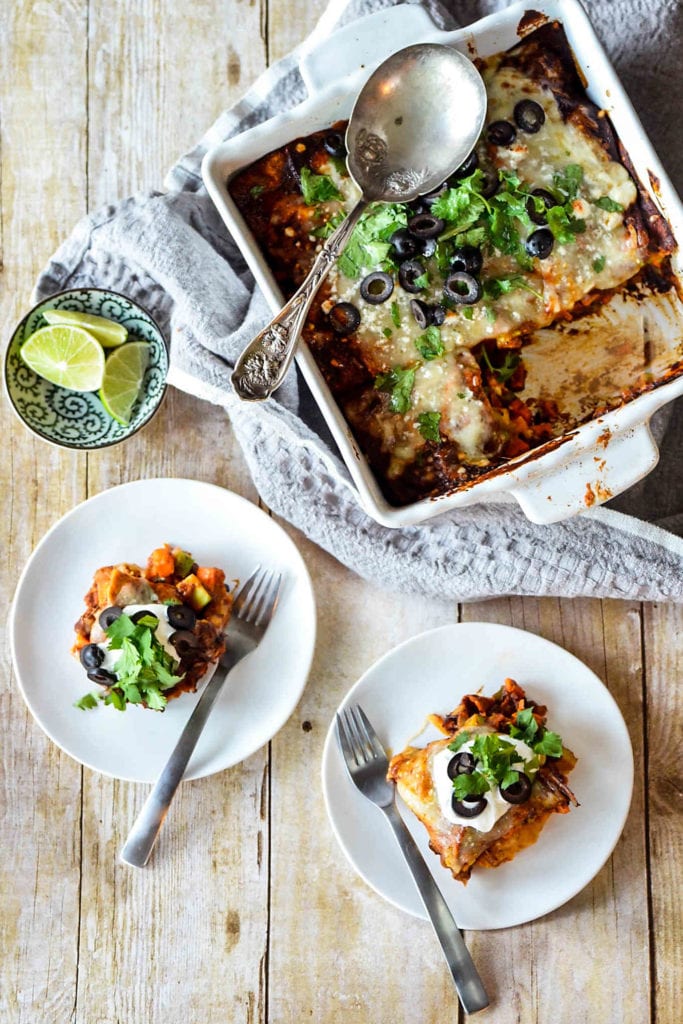 Serve up this layered baked enchilada dish as a delicious meatless dinner option! Sweet potatoes and black beans provide plenty of nutrients. #meatlessmonday #blackbeans