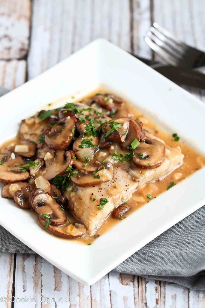 Tender white fish fillets are baked and smothered in a marsala wine mushroom sauce for a healthy, delicious baked fish recipe. 315 calories and 4 Weight Watchers Freestyle SP #fish #weightwatchers #marsala