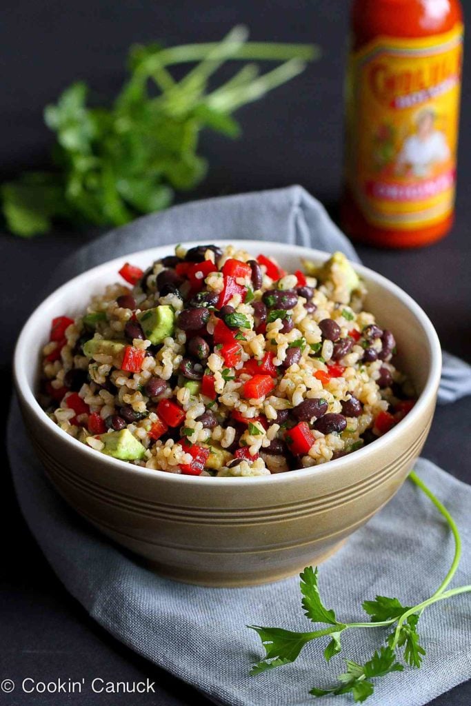 Have you ever made a hot sauce dressing? This one adds a ton of flavor to a simple rice and bean salad. #cincodemayo #recipe