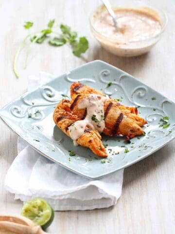 This quick and easy grilled chicken tenders recipe is taken from plain to phenomenal with the addition of an addictive chipotle lime yogurt. 179 calories and 2 Weight Watchers Freestyle SP #chickenrecipes #weightwatchers