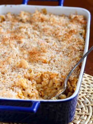 This light(er) macaroni and cheese recipe gets a burst of flavor and texture from mashed sweet potato and a great sharp cheddar cheese. #macncheese #pasta