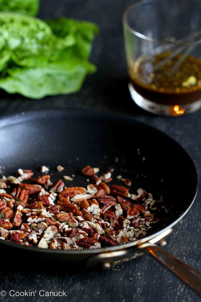 Chopped pecans in a nonstick skillet, ready to toast.