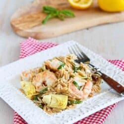 Whip up this pasta salad for a healthy make-ahead meal or to bring to a potluck. Whole wheat pasta, perfectly seared shrimp and artichokes make a fantastic combination! 313 calories and 6 Weight Watchers Freestyle SP #pasta #shrimp #recipe