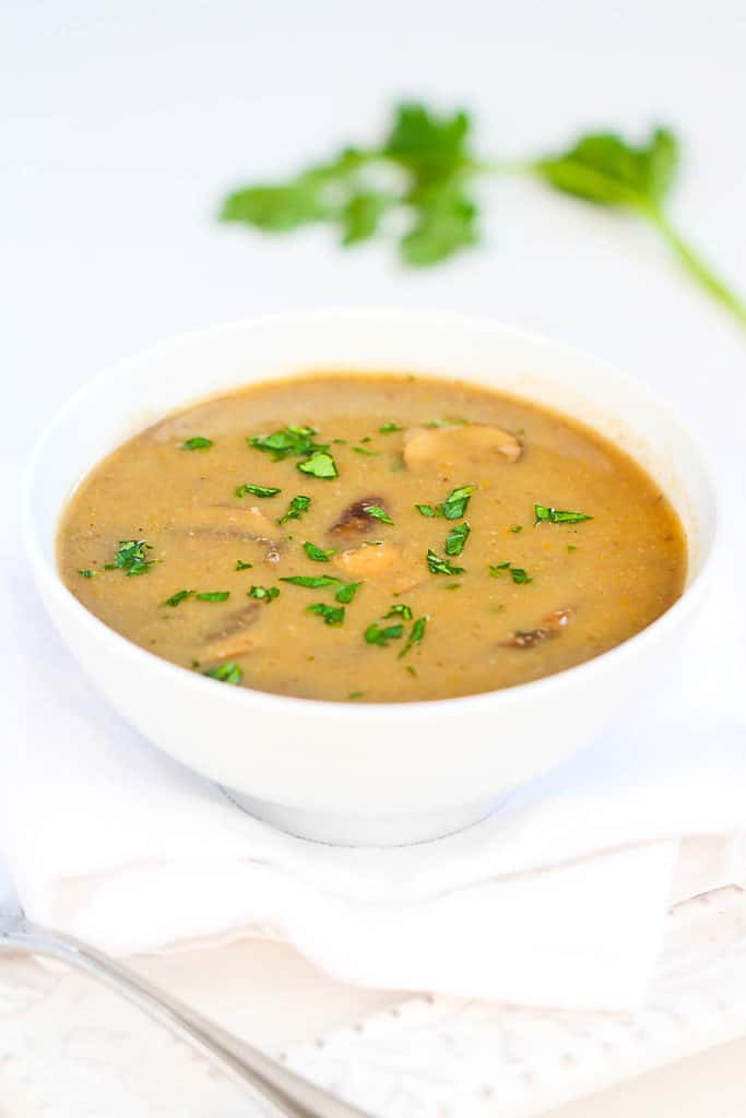 This vegan cream of mushroom soup recipe has the enticing texture of fresh mushrooms and a layer of flavor from a touch of curry. Only 101 calories and 2 Weight Watchers Freestyle SP per serving. #vegan #weightwatchers