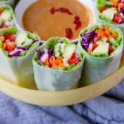 Vegan spring rolls with peanut sauce are my new obsession for light meals or appetizers! When you just don't feel like another salad, this is a fantastic way to fill up on veggies. 117 calories and 4 Weight Watchers Freestyle SP #vegan #recipe #weightwatchers