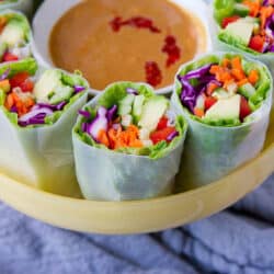 Vegan spring rolls with peanut sauce are my new obsession for light meals or appetizers! When you just don't feel like another salad, this is a fantastic way to fill up on veggies. 117 calories and 4 Weight Watchers Freestyle SP #vegan #recipe #weightwatchers