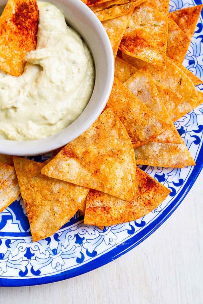 It takes mere minutes to make homemade baked tortilla chips. Sprinkled with smoked paprika and rosemary, these ones are something special! 78 calories and 2 Weight Watchers Freestyle SP #snacks #healthy #weightwatchers