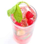 This raspberry mojito just took over as the queen of cocktails in my house. Tart, sweet, cold and refreshing, this classic cocktail gets a summertime makeover. 150 calories and 6 Weight Watchers Freestyle SP #mojito #cocktail #happyhour