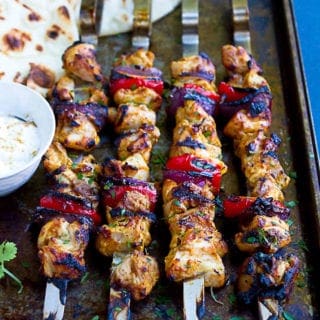 Up your grilling game with these flavor bomb Tandoori Grilled Chicken Kabobs. Serve them up with grilled naan bread and yogurt for an amazing meal! 188 calories and 4 Weight Watchers Freestyle SP #chicken #kabobs #wwfreestyle